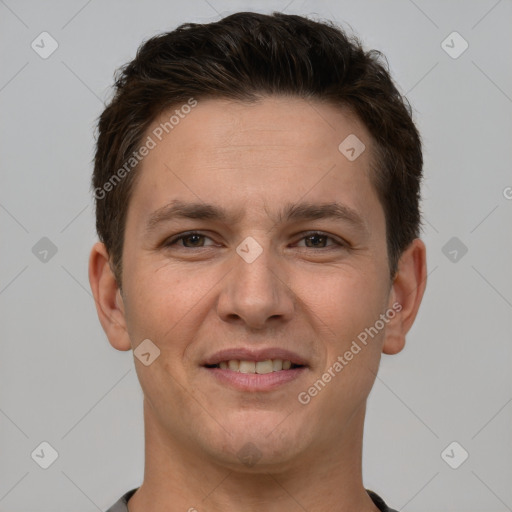 Joyful white young-adult male with short  brown hair and brown eyes