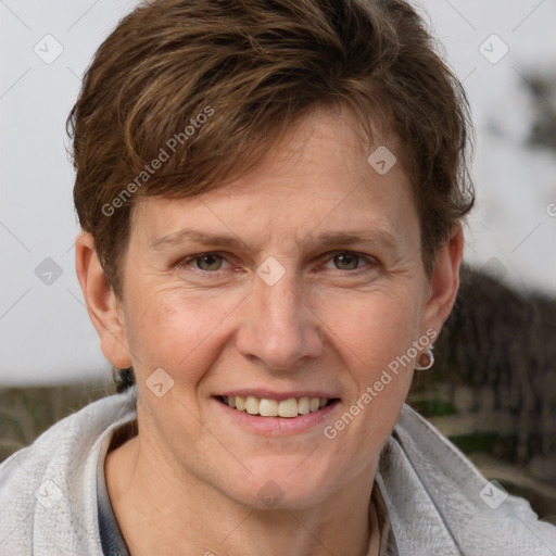 Joyful white adult female with short  brown hair and grey eyes