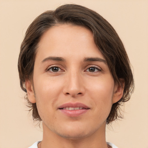 Joyful white young-adult female with medium  brown hair and brown eyes