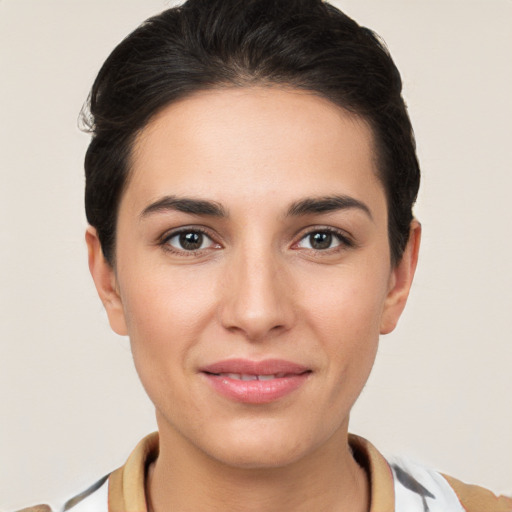 Joyful white young-adult female with short  brown hair and brown eyes