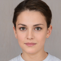 Neutral white young-adult female with short  brown hair and brown eyes