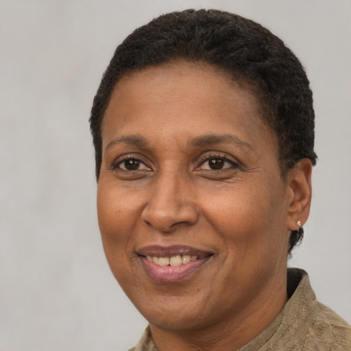 Joyful latino adult female with short  brown hair and brown eyes