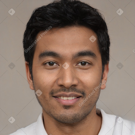 Joyful latino young-adult male with short  black hair and brown eyes