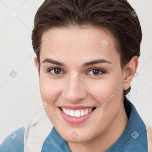 Joyful white young-adult female with short  brown hair and brown eyes