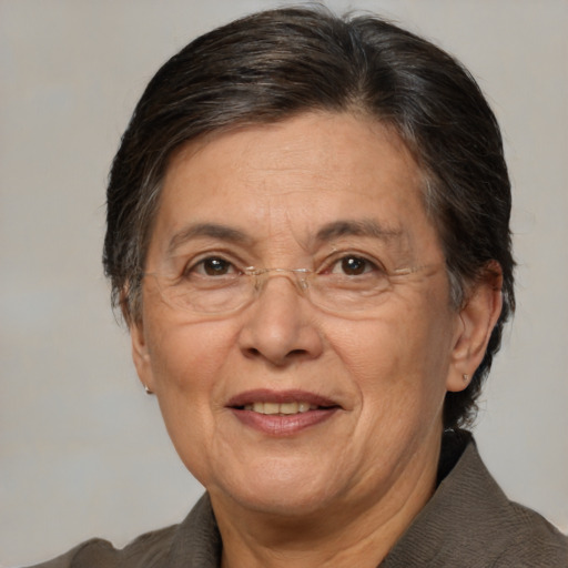 Joyful white middle-aged female with medium  brown hair and brown eyes