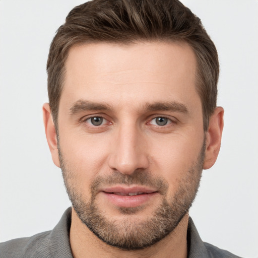 Joyful white young-adult male with short  brown hair and brown eyes