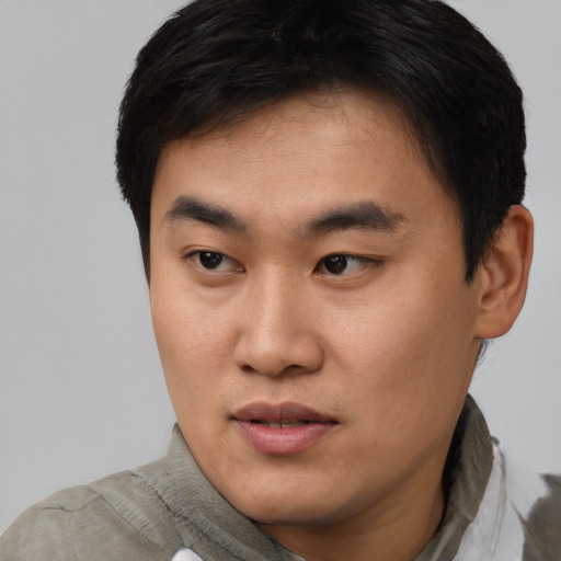 Neutral asian young-adult male with short  black hair and brown eyes