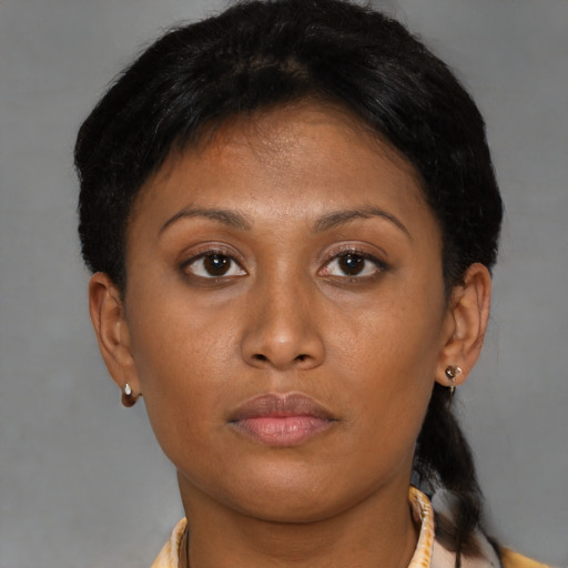 Neutral latino young-adult female with short  brown hair and brown eyes