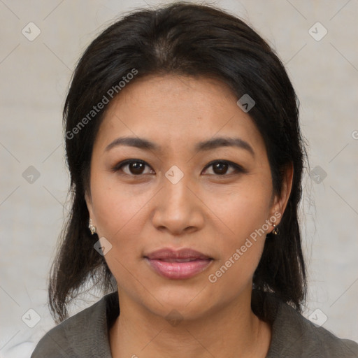 Joyful latino young-adult female with medium  brown hair and brown eyes