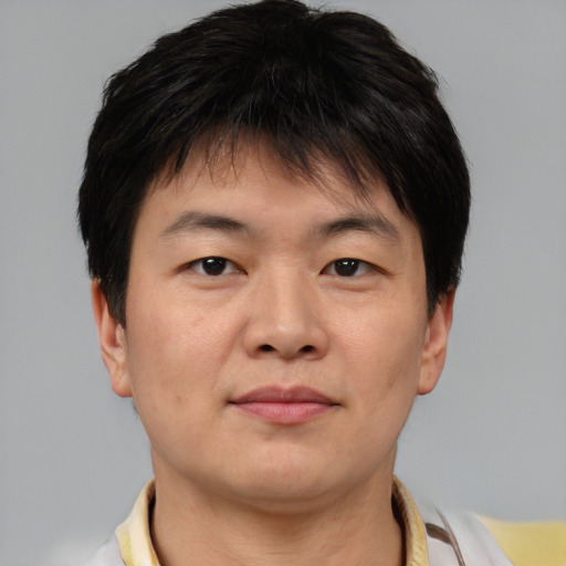Neutral asian young-adult male with short  brown hair and brown eyes