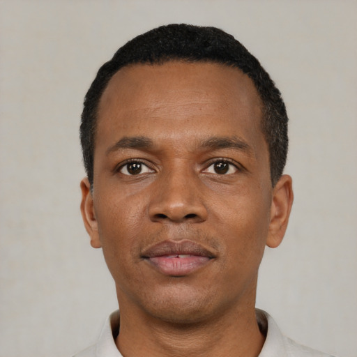 Neutral black young-adult male with short  black hair and brown eyes
