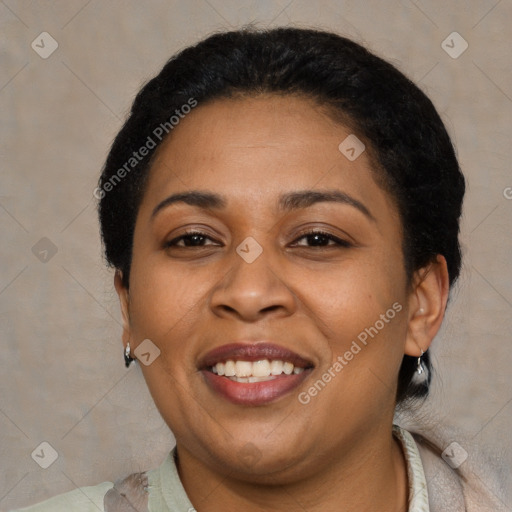 Joyful latino adult female with short  brown hair and brown eyes