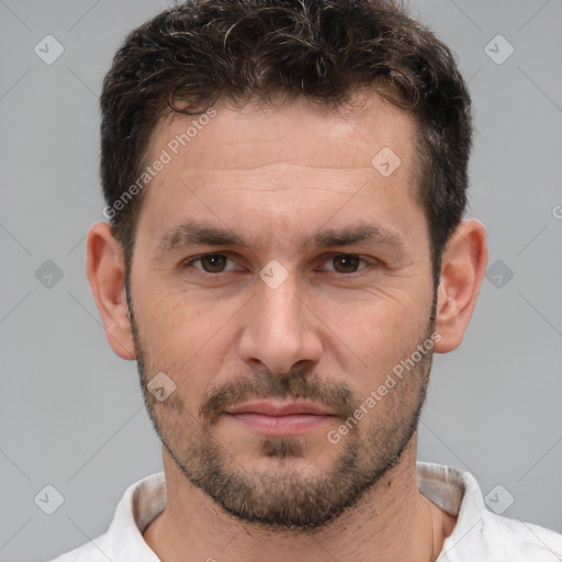 Joyful white adult male with short  brown hair and brown eyes