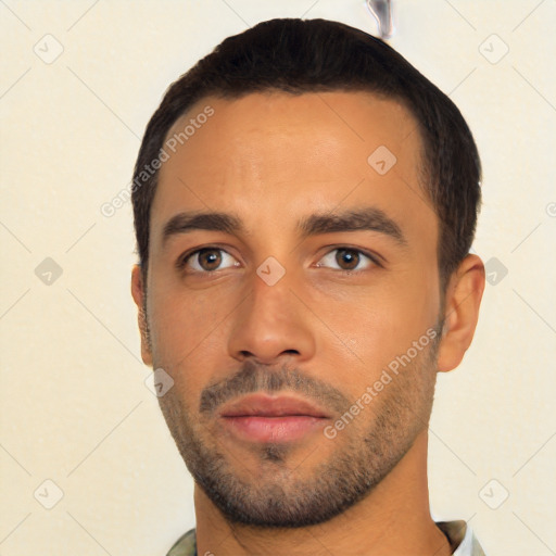 Neutral latino young-adult male with short  black hair and brown eyes