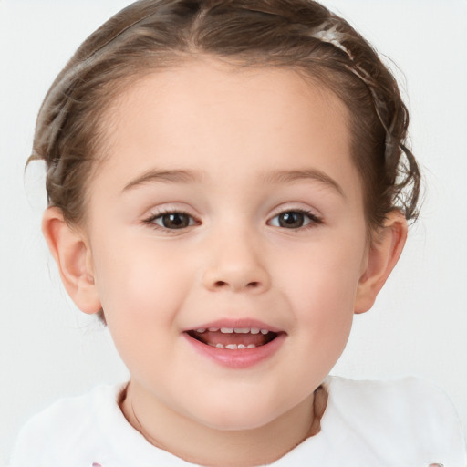 Joyful white child female with short  brown hair and brown eyes