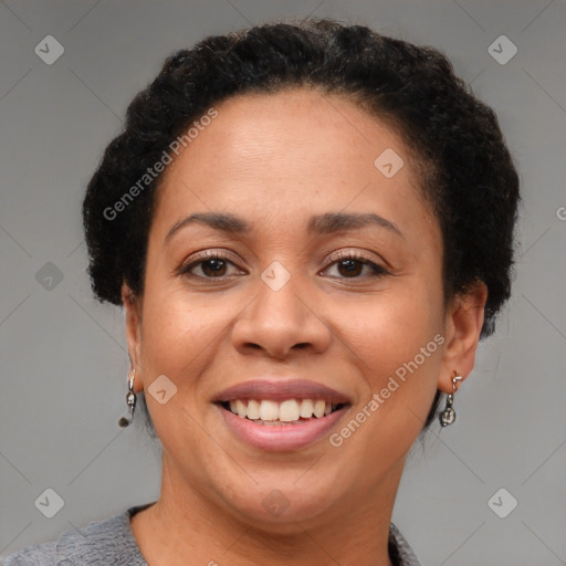 Joyful black adult female with short  brown hair and brown eyes