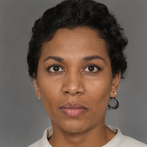 Neutral black young-adult female with short  black hair and brown eyes