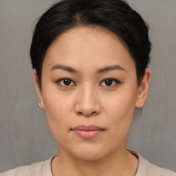 Neutral asian young-adult female with short  brown hair and brown eyes