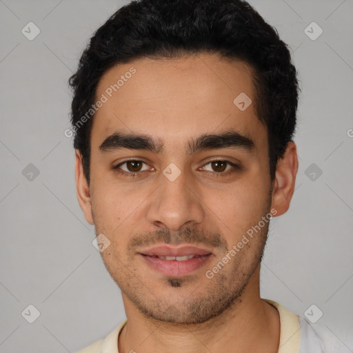 Joyful white young-adult male with short  black hair and brown eyes