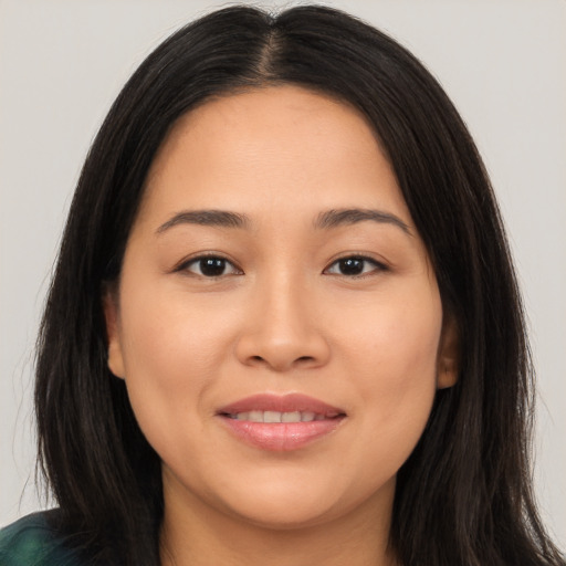 Joyful white young-adult female with long  brown hair and brown eyes