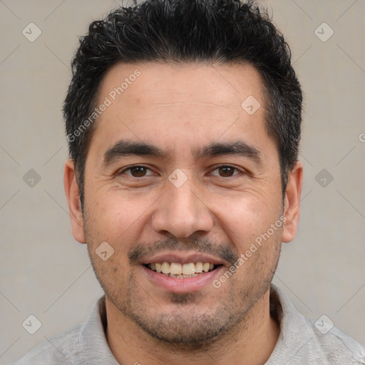 Joyful white adult male with short  black hair and brown eyes