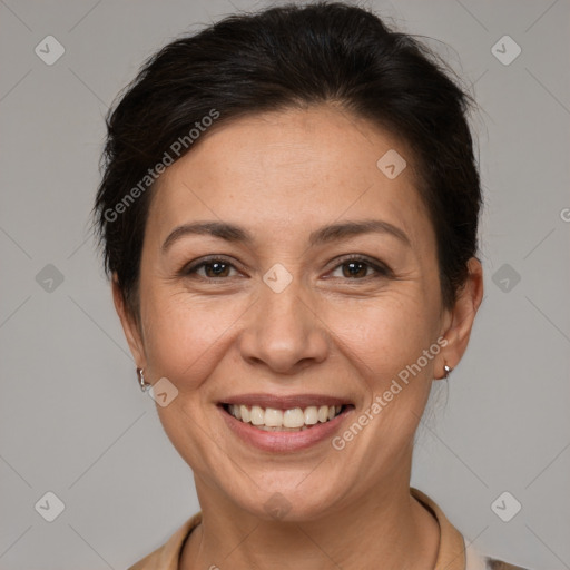 Joyful white adult female with short  brown hair and brown eyes