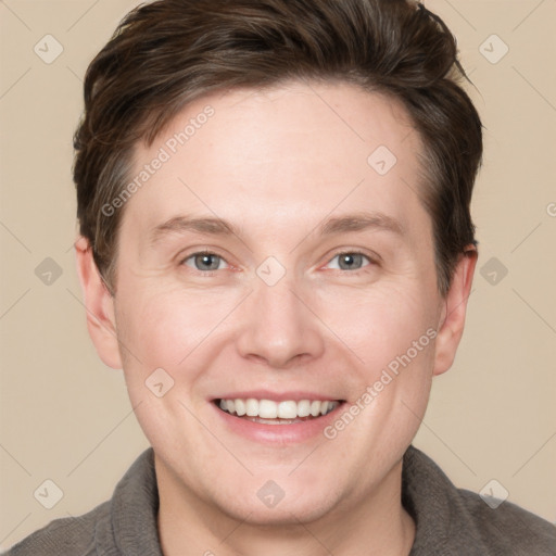 Joyful white adult male with short  brown hair and grey eyes