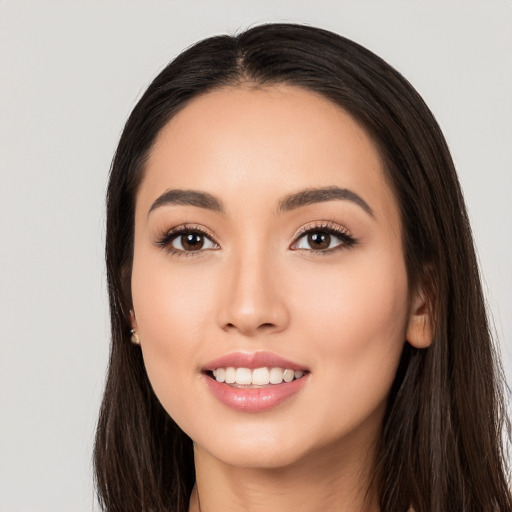 Joyful white young-adult female with long  black hair and brown eyes