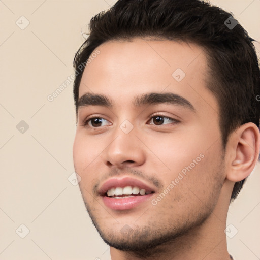 Joyful white young-adult male with short  black hair and brown eyes