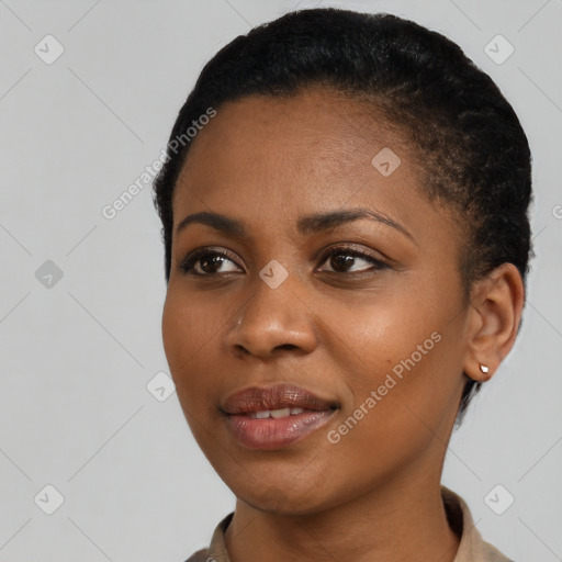 Joyful black young-adult female with short  black hair and brown eyes