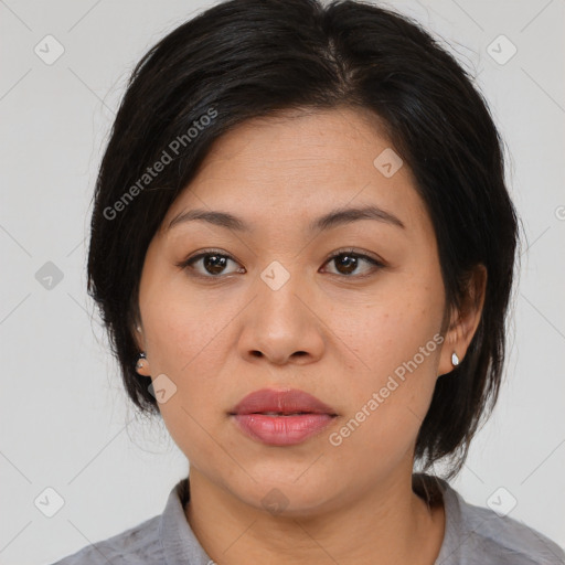 Joyful asian young-adult female with medium  black hair and brown eyes