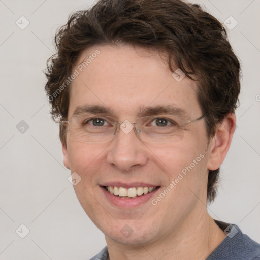 Joyful white adult male with short  brown hair and grey eyes