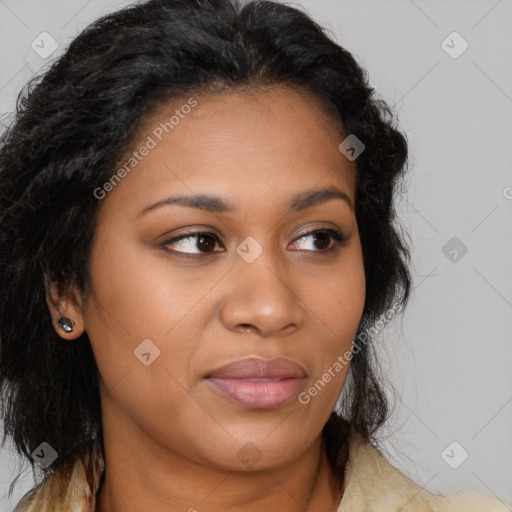 Joyful black young-adult female with long  brown hair and brown eyes