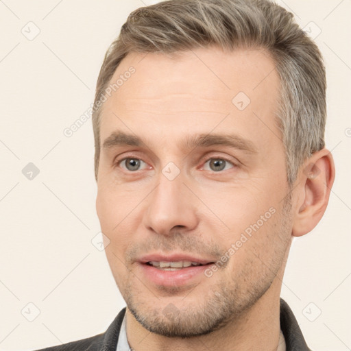 Joyful white adult male with short  brown hair and brown eyes