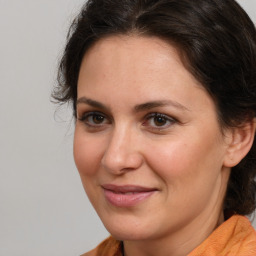 Joyful white adult female with medium  brown hair and brown eyes