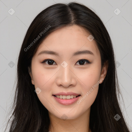 Joyful asian young-adult female with long  brown hair and brown eyes