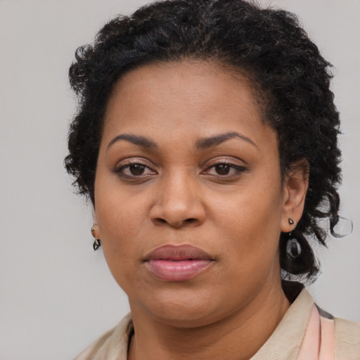 Neutral black young-adult female with short  brown hair and brown eyes