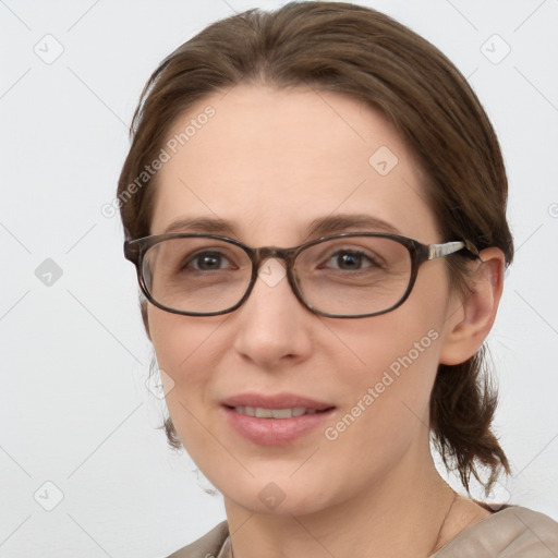 Joyful white young-adult female with medium  brown hair and grey eyes