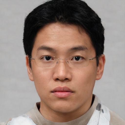Neutral asian young-adult male with short  black hair and brown eyes