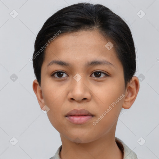 Joyful latino young-adult female with short  brown hair and brown eyes