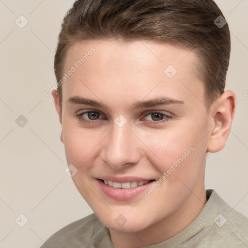 Joyful white young-adult female with short  brown hair and grey eyes