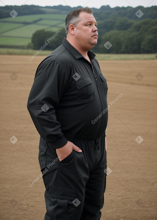 Caucasian middle-aged male with  black hair