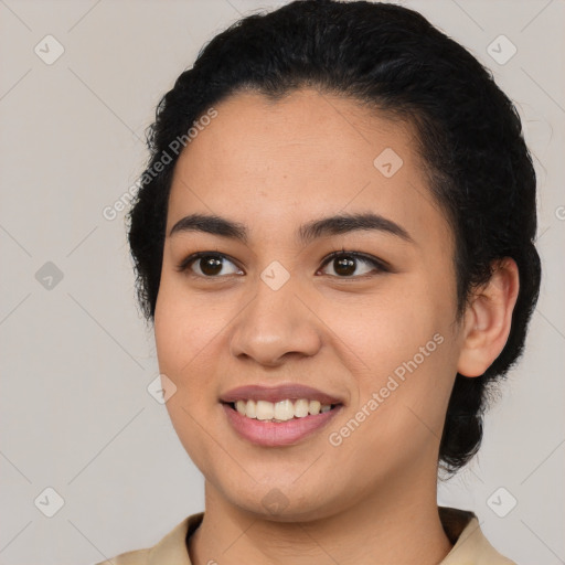 Joyful latino young-adult female with medium  black hair and brown eyes