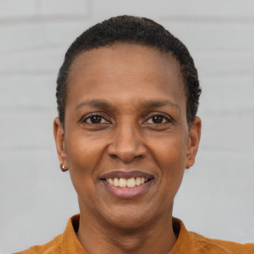 Joyful latino adult female with short  black hair and brown eyes