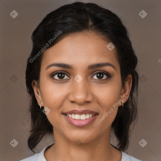 Joyful latino young-adult female with medium  brown hair and brown eyes