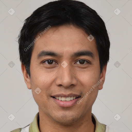 Joyful asian young-adult male with short  black hair and brown eyes