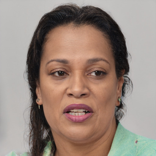 Joyful white adult female with medium  brown hair and brown eyes