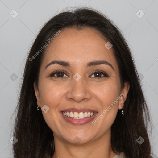 Joyful white adult female with long  brown hair and brown eyes