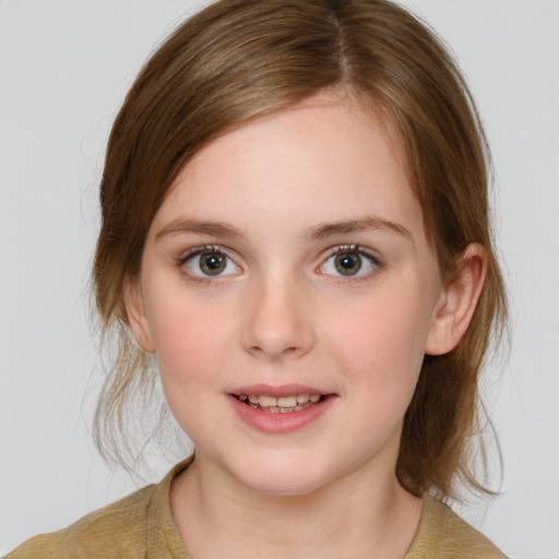 Joyful white child female with medium  brown hair and grey eyes