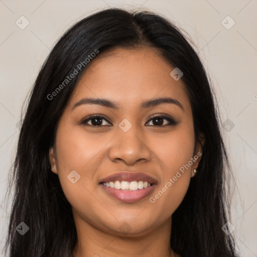 Joyful latino young-adult female with long  brown hair and brown eyes